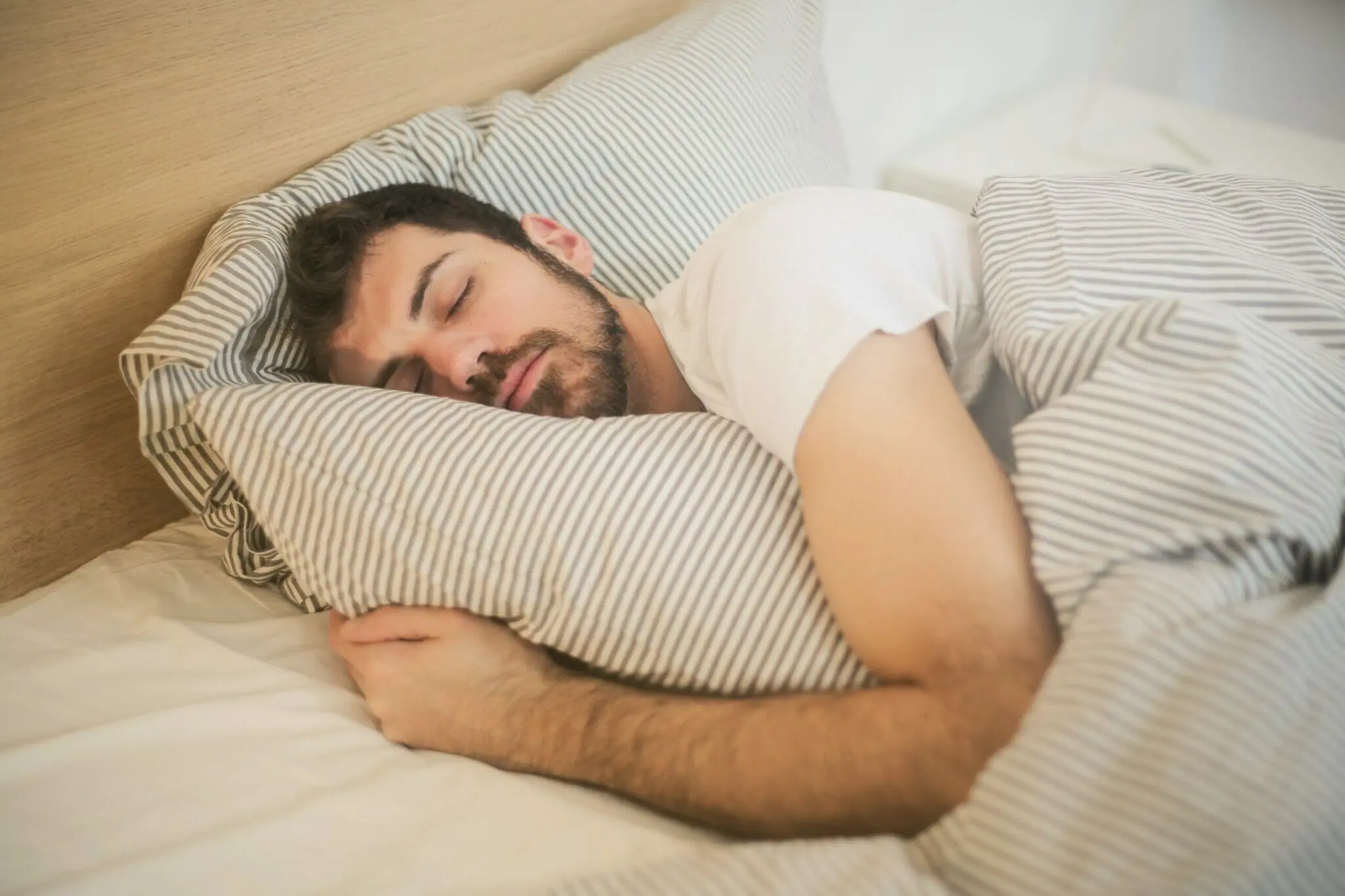 man sleeping in a bed