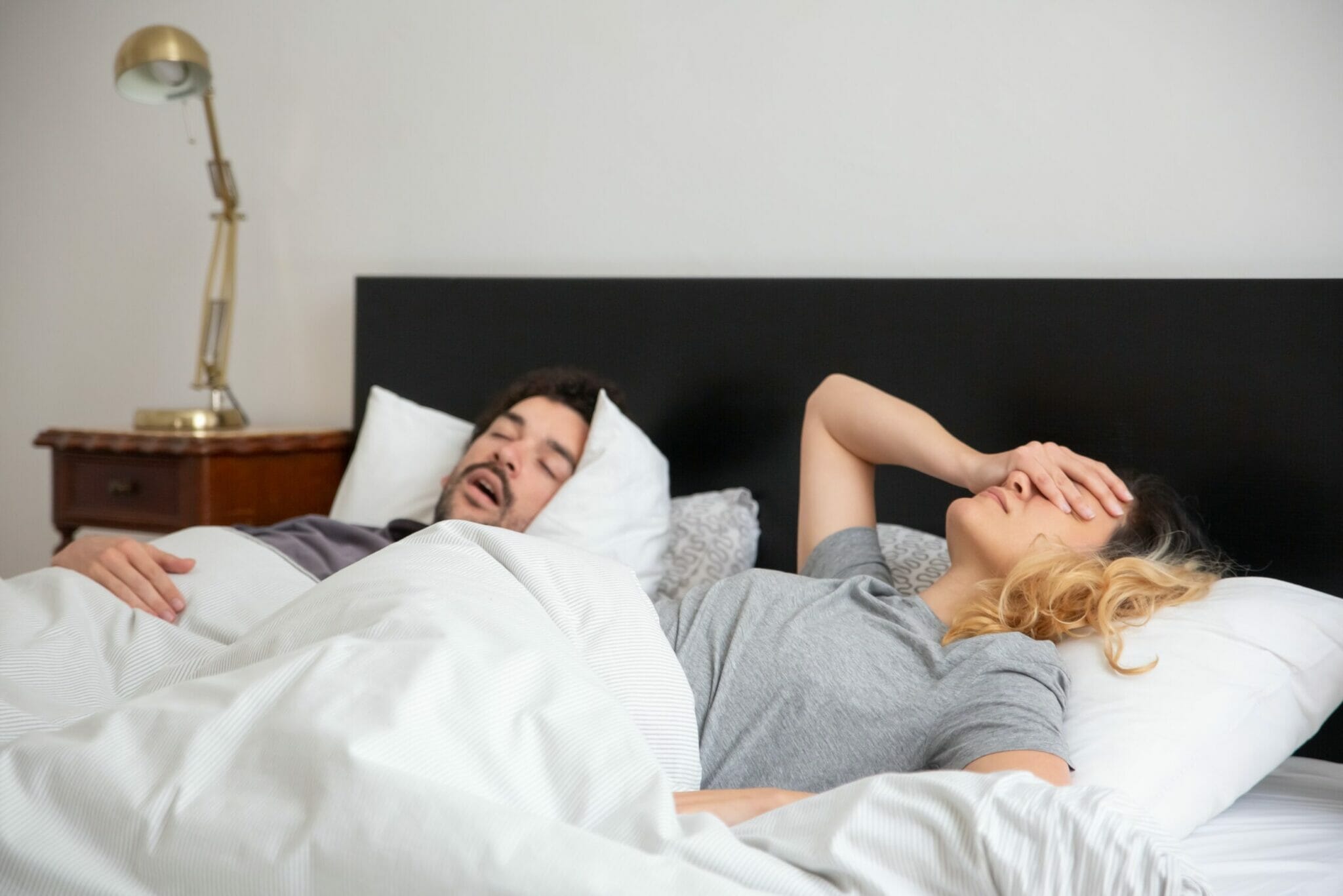 woman frustrated at her partner's snoring